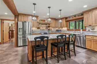 Hickory cabinets, granite countertops, High end appliances.. This space is BEAUTIFUL  Plenty of room for food prep in this country kitchen. The drawers on the Island are the FULL width of the island.. that is amazing.. SO MUCH STORAGE in this kitchen!