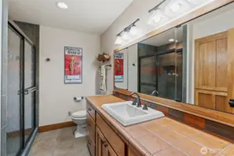 Primary Bath with HUGE shower.. Hidden behind the mirrors are the plug ins! They thought of everything!