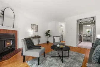 Beautiful hardwood laminate floors add warmth and elegance throughout the home.