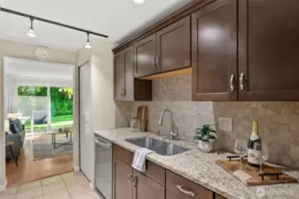 The kitchen was recently remodeled and features stunning granite countertops that add both beauty and durability.