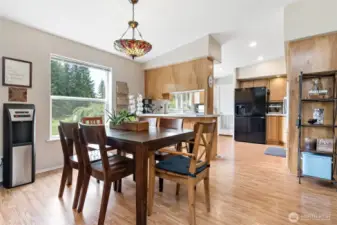 Dining area looking on to well laid out kitchen.