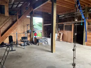 More space for additional stalls, equipment storage or what have you! Stairs to hay loft.