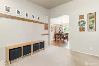 View of entryway looking on into the kitchen and eating space.