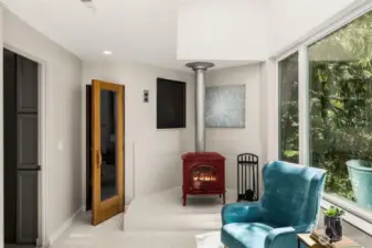 Your primary suite has a lovely sitting area with a wood stove, and a sauna!