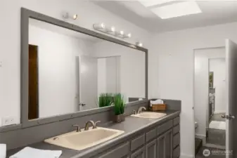 The en-suite bathroom offers a double sink & large walk-in closet.