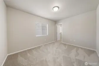 2nd bedroom upstairs with a walk-in closet.