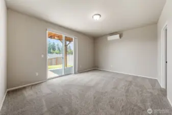Basement bedroom suite with full bath and walk-in closet. Another sliding glass door to a covered patio.