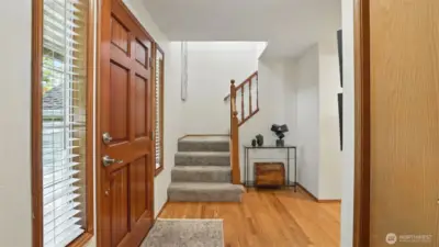 Spacious entryway features hardwood flooring.