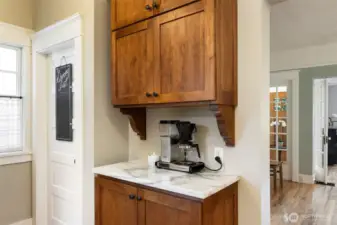 This coffee bar is super convenient and adds style points as well. The door to the left in the photo leads to the lower level.