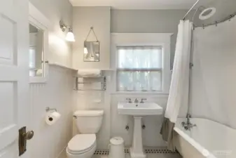 The upstairs hall bathroom was updated in keeping with the original style.