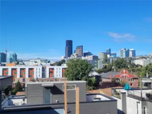 Views of the Seattle skyline from 2 rooftop decks