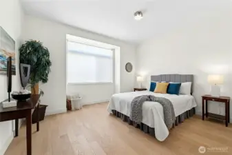 Primary suite with rolling window covering perfect for privacy without sacrificing natural light.