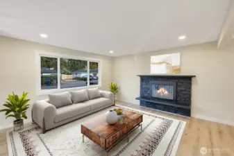Gorgeous fireplace in living room make this setting extremely cozy. virtual staging