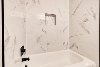 Upstairs main hallway bathtub.