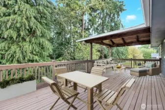 Enormous back deck with part of it covered for year round enjoyment! virtual staging