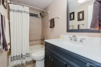 Remodeled bath with tile shower