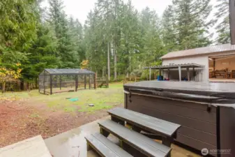 Back yard with hot tub, out buildings and chicken coop