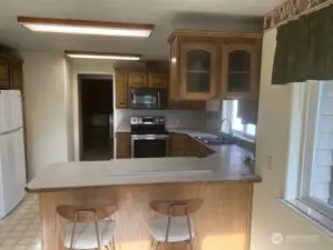 Kitchen counter works as breakfast bar.