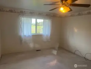 Primary bedroom with 3/4 bath and walk in closet.