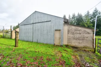Barn has a large sliding door for easy hay delivery.