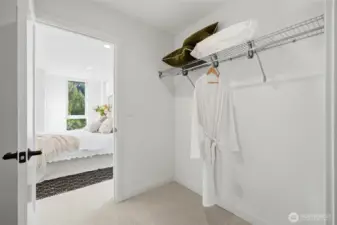 Walk-in closet with built-in wire shelving and direct access from the primary bedroom.