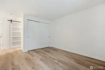 Large primary bedroom has unique walk-through closet.
