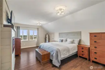 Primary bedroom with built in electric fireplace