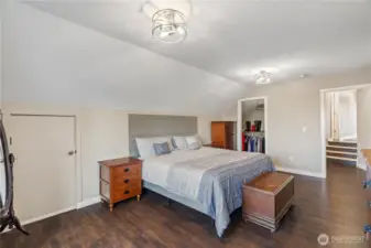 Primary bedroom with walk-in closet