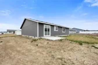 Needs a little grass and sprinklers in the back yard.  Or do a hardscape instead!