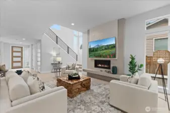 With its dramatic fireplace, soaring ceilings, and expansive natural light, the great room is both a statement in design and a sanctuary for everyday living.