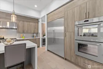 From the integrated refrigerator to the double ovens, every appliance was selected to support a kitchen experience defined by precision, beauty, and modern ease.