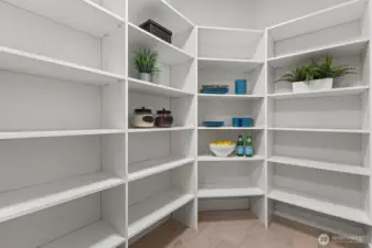 With abundant built-in shelving and exceptional storage, the walk-in pantry is designed to keep the kitchen as functional as it is beautiful.