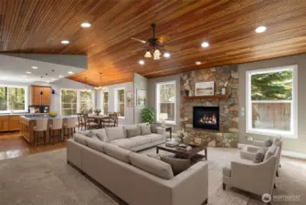 Virtually staged living room with cozy river rock fireplace (propane fired)