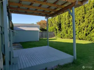 Newer Huge Entertainment Sized Deck looking into the Private Pet Friendly Fully Fenced Backyard.