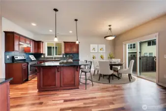 Cherry stained cabinets, island and ample counter space.