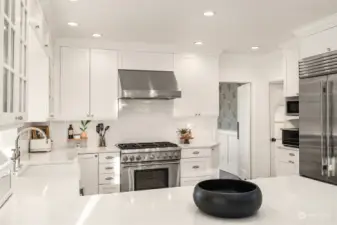 Another view of the kitchen, showing the flow between the kitchen and dining room.  It even has a swing door to create privacy for more formal entertaining.