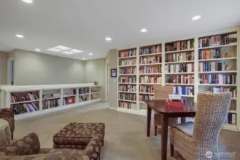 Upstairs loft with built-in bookshelves.