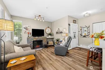 Warm, inviting, and full of charm! The updated fireplace make this living room feel like home the second you walk in.