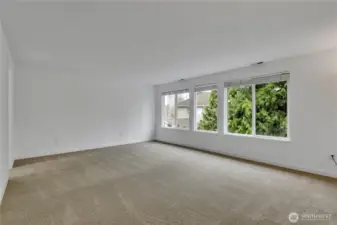 The primary bedroom suite is extremely spacious with lots of natural light.