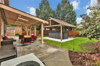 Take your fun and relaxation to a new level all year long with the huge, covered Jacuzzi spa. It also serves as a swim spa for the perfect way to exercise in your private backyard oasis.