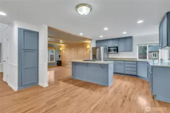 The well-appointed kitchen is light and bright and opens to the living room and informal dining space.