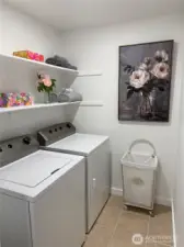 Spacious Laundry Room w/ ample shelving storage