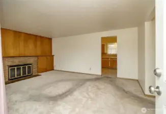 Spacious living room with wood-burning fireplace