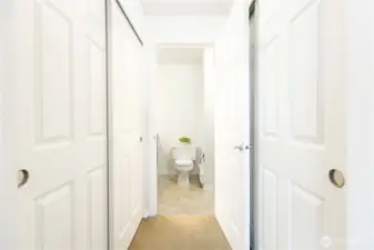 2 closets in the hallway to the primary bathroom
