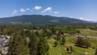 View of golf course and mountains from deck