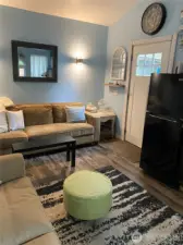 Decorative lighting on the north wall. Lots of room for hideaway bed, sofa, chairs.