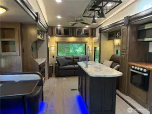 Full kitchen with sink in island. Full range, Dinette and living room combo.
