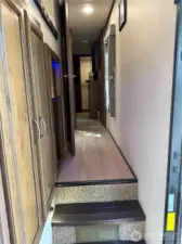 Storage in hallway leading to the bath and primary bedroom.