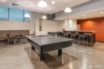 Game Room - South Tower, 1st Floor - Includes: Amazon HUB locker (24 hour access), foosball table, convertible ping pong to pool large tv, sink, and refrigerator.