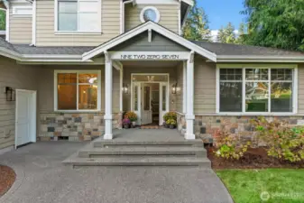 The large front porch invites you in with cozy fall vibes.